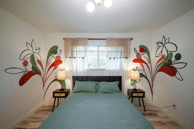 5918 Lattimer Dr, Houston, TX 77035 - bedroom with light wood-type flooring and baseboards