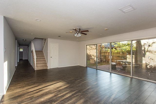 6407 Nuben St, Houston, TX 77091 - spare room with wood finished floors, a ceiling fan, stairway, and a textured ceiling
