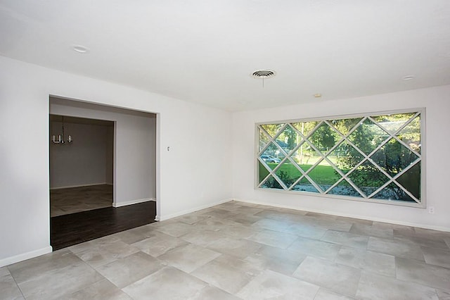 6407 Nuben St, Houston, TX 77091 - empty room featuring baseboards and stone finish floors