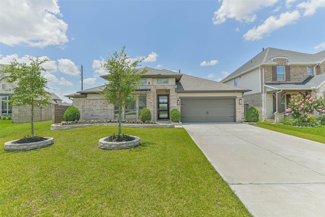 20519 Grazing Foal Ln, Tomball, TX 77377 - view of front facade with concrete driveway, an attached garage, and brick siding