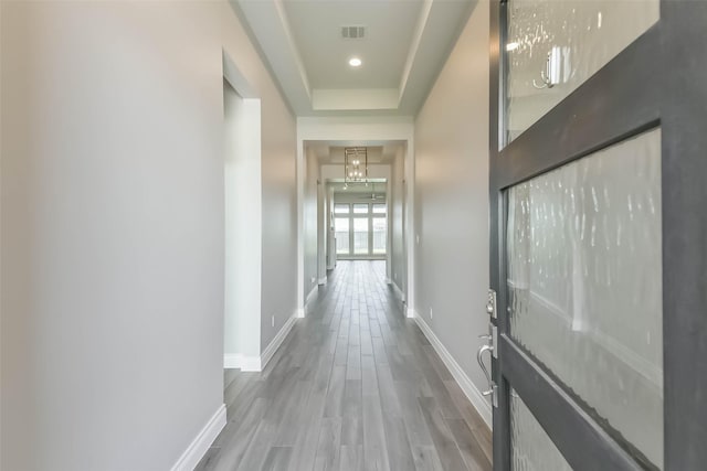 20519 Grazing Foal Ln, Tomball, TX 77377 - hall featuring wood finished floors and a tray ceiling
