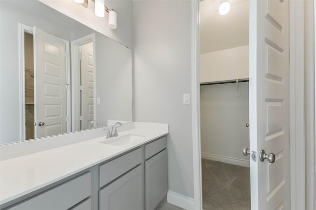 20519 Grazing Foal Ln, Tomball, TX 77377 - bathroom featuring vanity and a spacious closet