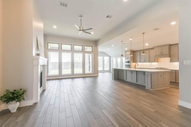 20519 Grazing Foal Ln, Tomball, TX 77377 - kitchen with gray cabinetry, open floor plan, a ceiling fan, light wood-style flooring, and recessed lighting