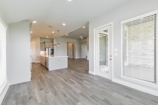 20519 Grazing Foal Ln, Tomball, TX 77377 - unfurnished living room featuring light wood finished floors and recessed lighting