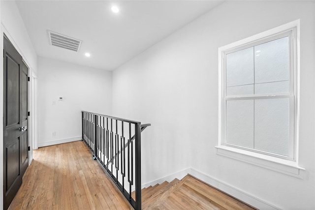 1011 E 28th St, Houston, TX 77009 - hall featuring an upstairs landing, recessed lighting, and light wood-style flooring