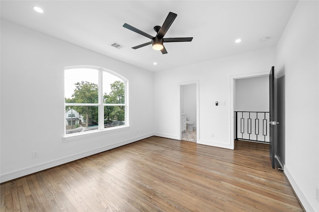 1011 E 28th St, Houston, TX 77009 - unfurnished room featuring a ceiling fan, wood-type flooring, and recessed lighting