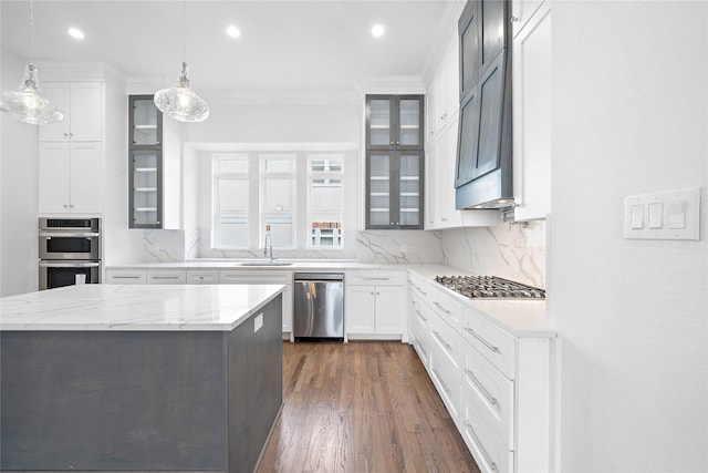 1011 E 28th St, Houston, TX 77009 - kitchen with appliances with stainless steel finishes, tasteful backsplash, crown molding, glass insert cabinets, and recessed lighting
