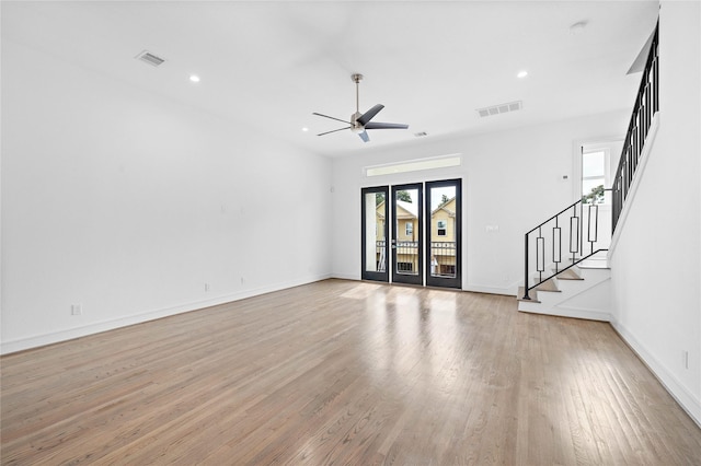 1011 E 28th St, Houston, TX 77009 - unfurnished living room featuring light wood-type flooring, a ceiling fan, stairs, and recessed lighting