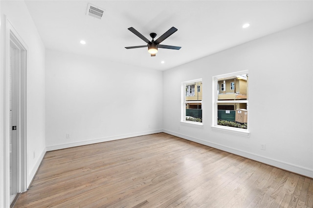1011 E 28th St, Houston, TX 77009 - spare room featuring wood finished floors, ceiling fan, and recessed lighting