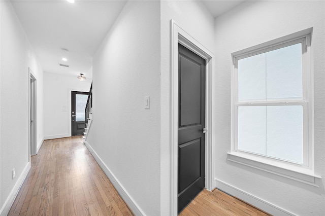 1011 E 28th St, Houston, TX 77009 - hallway featuring light wood finished floors, healthy amount of natural light, and recessed lighting