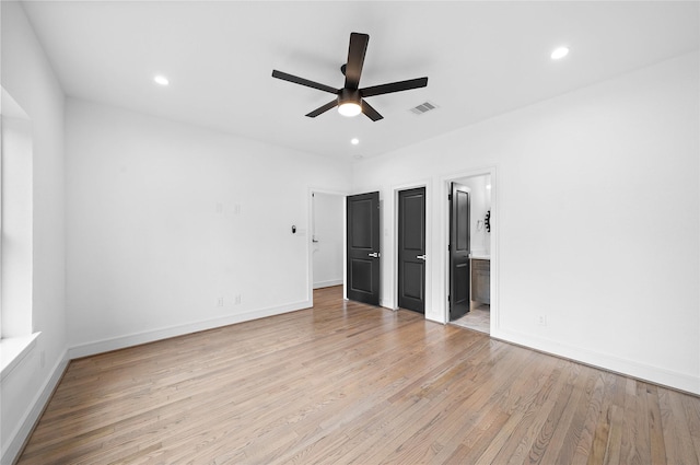 1011 E 28th St, Houston, TX 77009 - unfurnished bedroom featuring light wood finished floors, recessed lighting, ensuite bathroom, and a ceiling fan