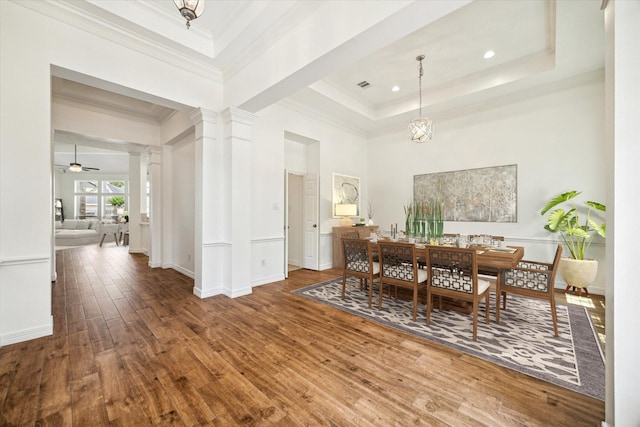 12210 Pebble Mdws, Houston, TX 77041 - dining area with hardwood / wood-style floors, a raised ceiling, ornate columns, crown molding, and a ceiling fan