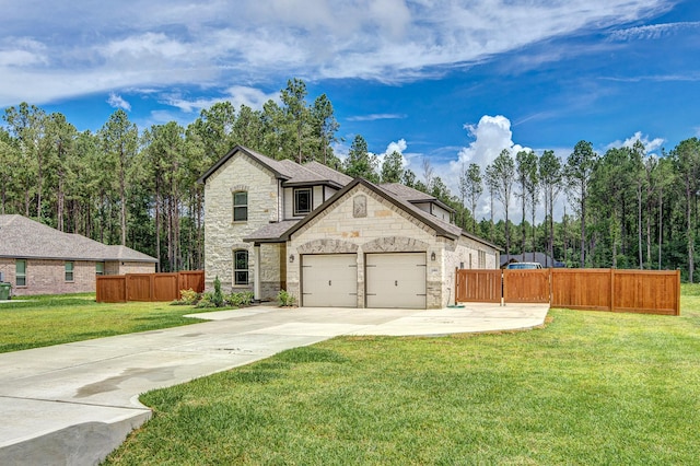 1563 Rd 66114, Dayton, TX 77535 - french country home featuring stone siding, concrete driveway, and a garage