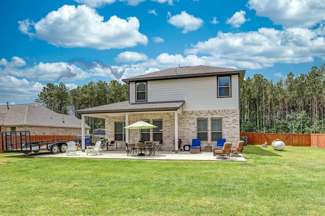 1563 Rd 66114, Dayton, TX 77535 - back of house featuring a patio area and brick siding