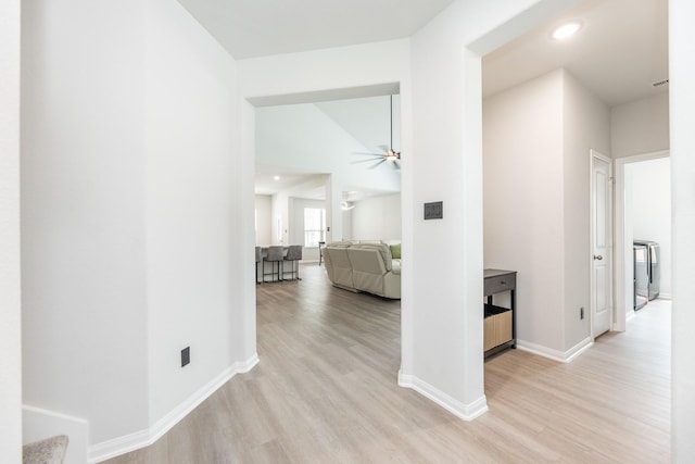 1563 Rd 66114, Dayton, TX 77535 - hallway with wood finished floors, washer / clothes dryer, recessed lighting, and lofted ceiling