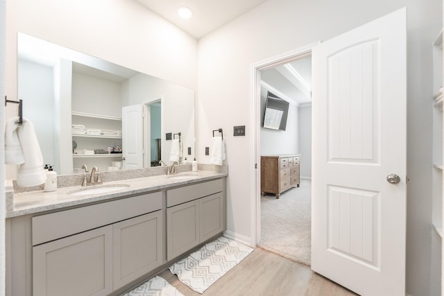 1563 Rd 66114, Dayton, TX 77535 - bathroom with wood finished floors and double vanity