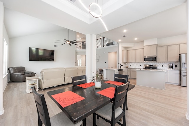 1563 Rd 66114, Dayton, TX 77535 - dining room with a towering ceiling, light wood-style flooring, ceiling fan, recessed lighting, and ornate columns