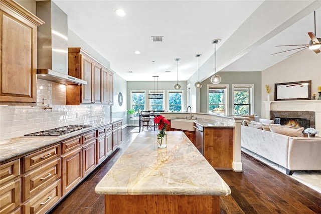 5523 Harvest Oak Landing Dr, Spring, TX 77386 - kitchen featuring appliances with stainless steel finishes, a center island with sink, wall chimney range hood, dark wood-style floors, and recessed lighting