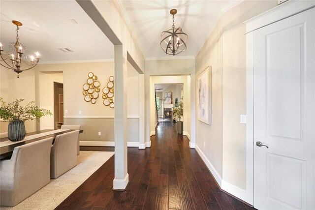 5523 Harvest Oak Landing Dr, Spring, TX 77386 - foyer with a chandelier, dark wood-style floors, and ornamental molding