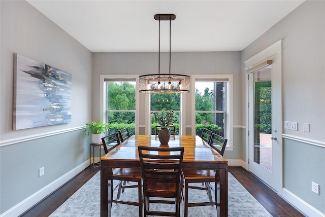 5523 Harvest Oak Landing Dr, Spring, TX 77386 - dining area with a chandelier and dark wood finished floors