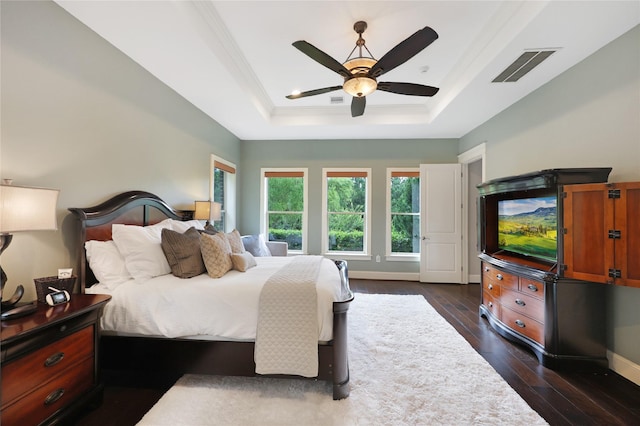 5523 Harvest Oak Landing Dr, Spring, TX 77386 - bedroom with a raised ceiling, dark wood finished floors, ceiling fan, and ornamental molding