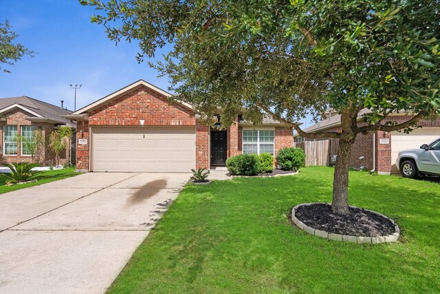 20930 Morgan Knoll Ln, Katy, TX 77449 - view of front of home featuring an attached garage, brick siding, and driveway