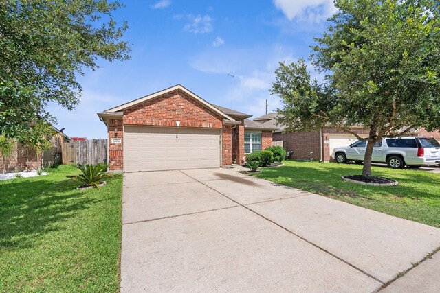 20930 Morgan Knoll Ln, Katy, TX 77449 - view of front of home featuring brick siding, a garage, and driveway
