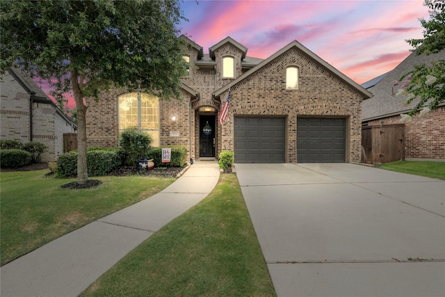 16711 Ramsay Cascades Dr, Humble, TX 77346 - view of front of property featuring brick siding, an attached garage, and concrete driveway