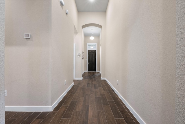 16711 Ramsay Cascades Dr, Humble, TX 77346 - corridor with arched walkways and dark wood-style floors