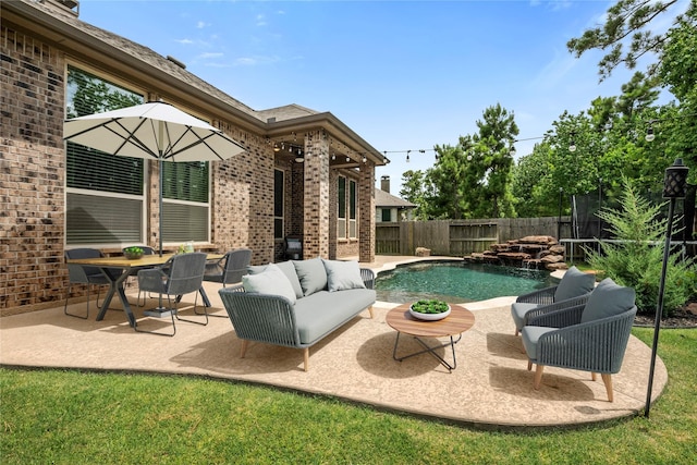 16711 Ramsay Cascades Dr, Humble, TX 77346 - fenced backyard featuring a patio and an outdoor hangout area