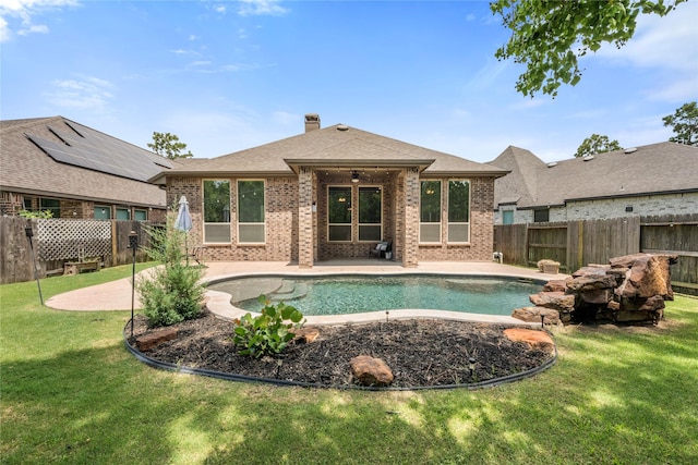 16711 Ramsay Cascades Dr, Humble, TX 77346 - back of property featuring brick siding, a patio area, a fenced backyard, and a chimney