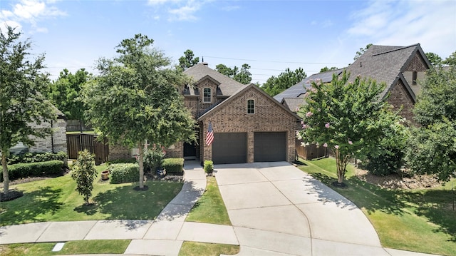 16711 Ramsay Cascades Dr, Humble, TX 77346 - view of front of home featuring brick siding, concrete driveway, an attached garage, and a shingled roof