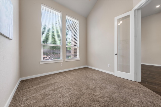 16711 Ramsay Cascades Dr, Humble, TX 77346 - unfurnished bedroom with carpet flooring, vaulted ceiling, and french doors