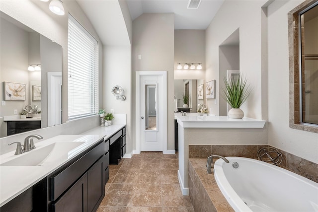 16711 Ramsay Cascades Dr, Humble, TX 77346 - full bathroom featuring a bath and two vanities