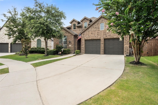16711 Ramsay Cascades Dr, Humble, TX 77346 - view of front of property featuring brick siding and concrete driveway