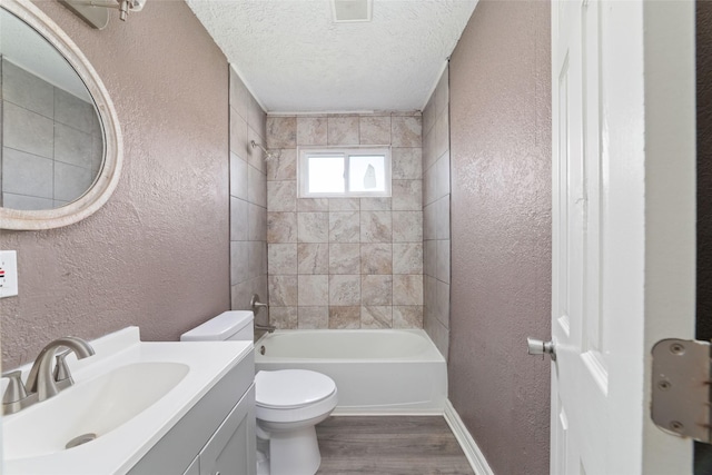 9333 Fairland Dr, Houston, TX 77051 - bathroom with a textured wall, wood finished floors, shower / tub combination, vanity, and a textured ceiling
