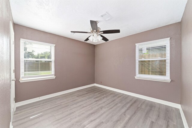 9333 Fairland Dr, Houston, TX 77051 - spare room featuring wood finished floors and ceiling fan