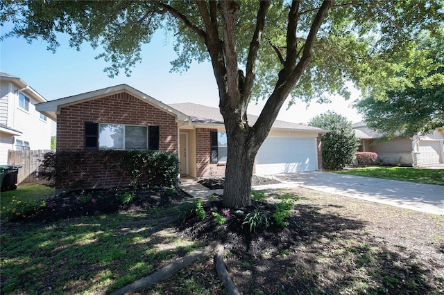 2926 Umiak Dr, Houston, TX 77045 - view of front of house with brick siding, driveway, and a garage