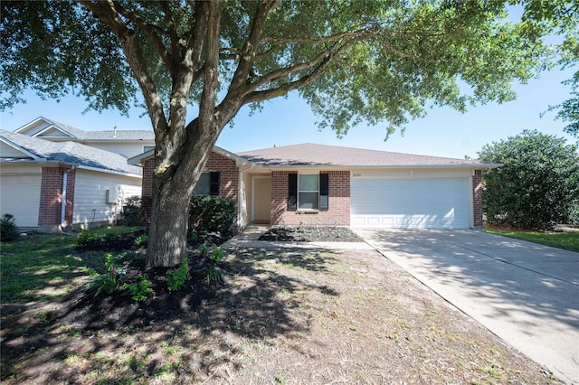 2926 Umiak Dr, Houston, TX 77045 - ranch-style house featuring brick siding, an attached garage, and concrete driveway