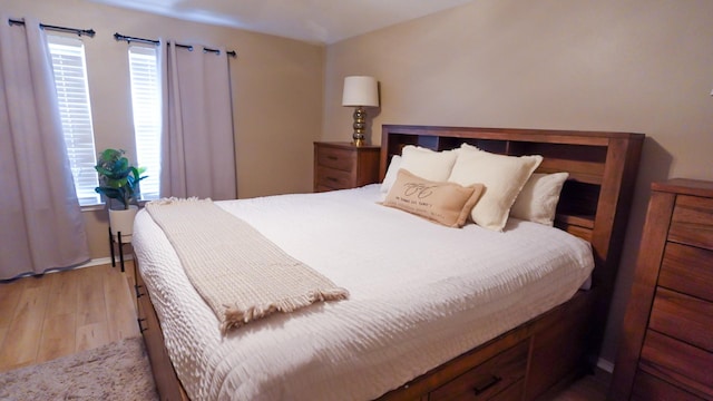 2926 Umiak Dr, Houston, TX 77045 - bedroom featuring multiple windows and light wood-style floors