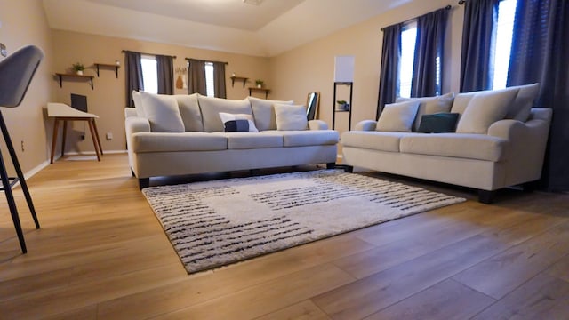 2926 Umiak Dr, Houston, TX 77045 - living room featuring healthy amount of natural light, wood finished floors, and lofted ceiling