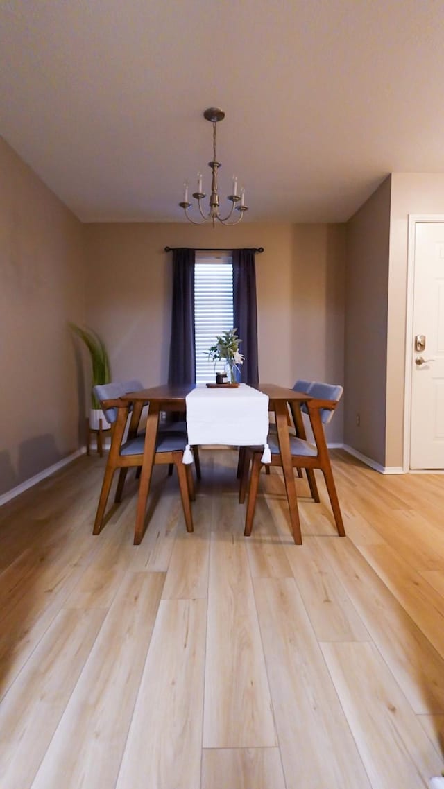 2926 Umiak Dr, Houston, TX 77045 - dining space with a chandelier and light wood-style flooring