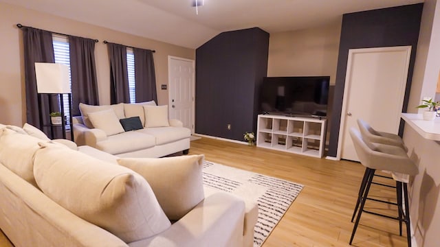 2926 Umiak Dr, Houston, TX 77045 - living area featuring light wood-style floors and vaulted ceiling