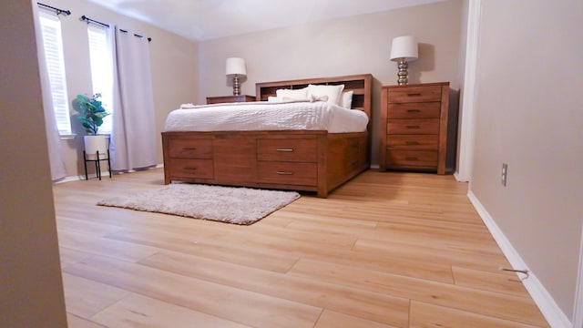 2926 Umiak Dr, Houston, TX 77045 - bedroom featuring light wood-style floors and baseboards