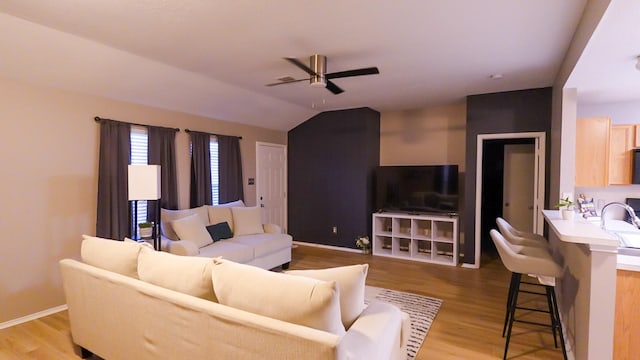 2926 Umiak Dr, Houston, TX 77045 - living room with ceiling fan, light wood finished floors, and vaulted ceiling