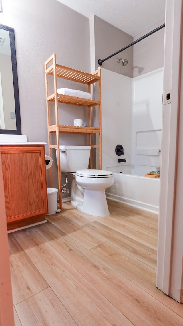 2926 Umiak Dr, Houston, TX 77045 - bathroom with wood finished floors, shower / bath combination, and vanity