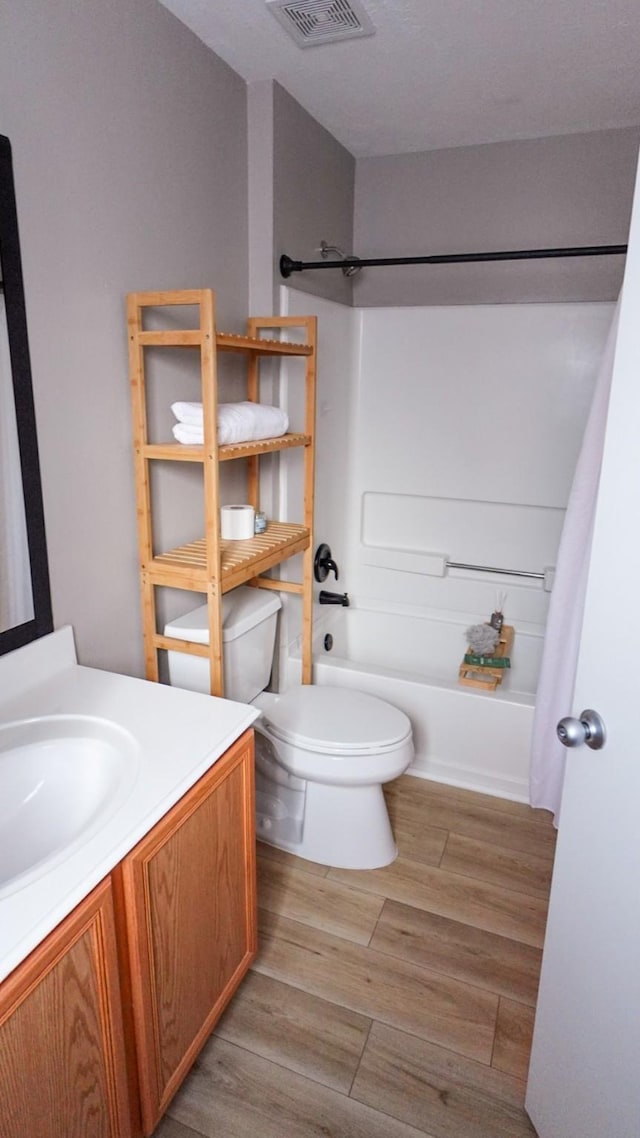 2926 Umiak Dr, Houston, TX 77045 - full bathroom with vanity,  shower combination, and wood finished floors