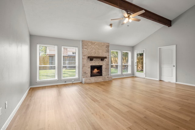 14902 Forest Lodge Dr, Houston, TX 77070 - unfurnished living room featuring beamed ceiling, light wood-style floors, plenty of natural light, ceiling fan, and high vaulted ceiling