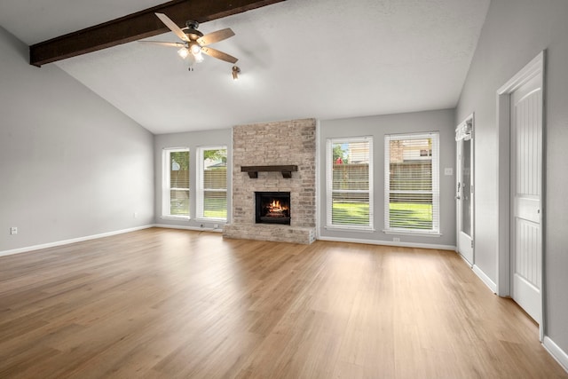 14902 Forest Lodge Dr, Houston, TX 77070 - unfurnished living room featuring ceiling fan, light wood-type flooring, and a fireplace