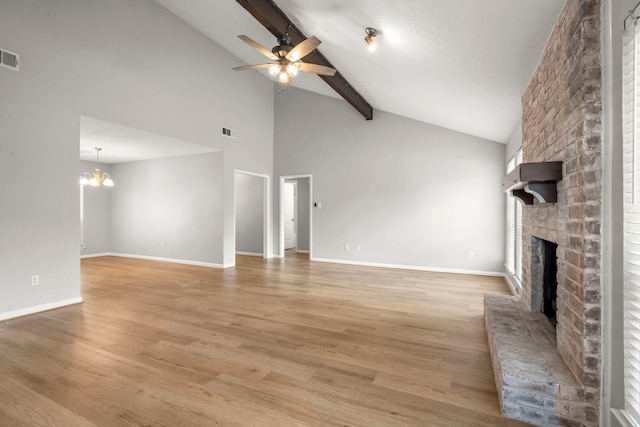 14902 Forest Lodge Dr, Houston, TX 77070 - unfurnished living room with a fireplace, a ceiling fan, beam ceiling, light wood finished floors, and high vaulted ceiling